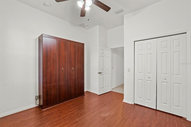 unfurnished bedroom with hardwood / wood-style flooring and ceiling fan