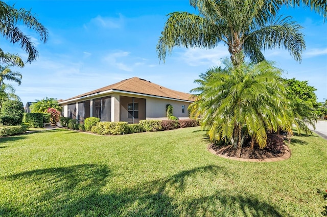 view of yard with a sunroom