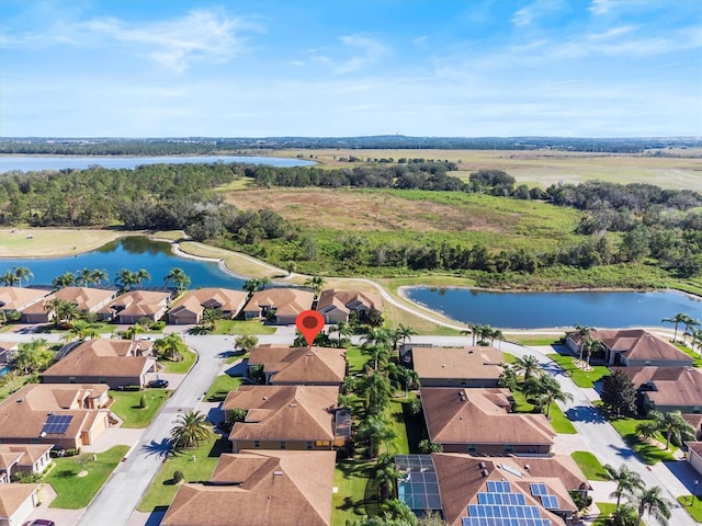 drone / aerial view with a water view