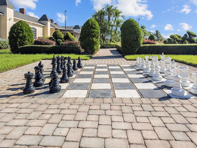 view of property's community with a patio