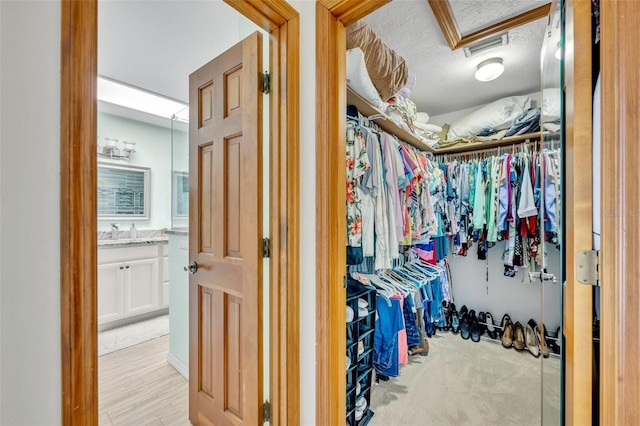 walk in closet featuring light wood-type flooring