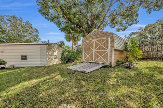 view of outbuilding featuring a yard