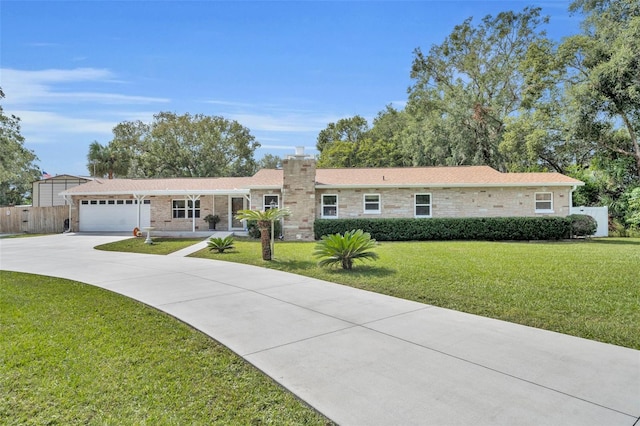 ranch-style house with a front yard and a garage