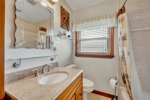 bathroom featuring toilet, shower / bath combo, vanity, baseboards, and tile patterned floors