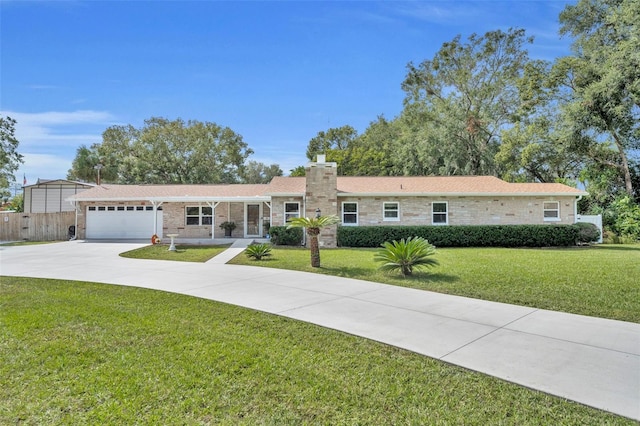 ranch-style house featuring a chimney, an attached garage, fence, driveway, and a front lawn