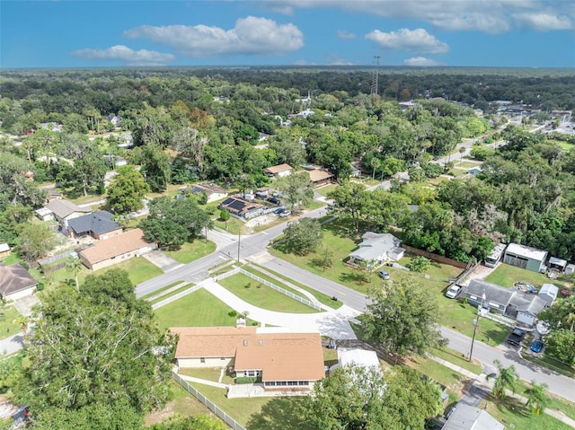 birds eye view of property with a view of trees