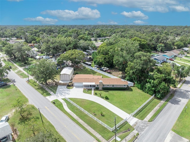 bird's eye view with a wooded view