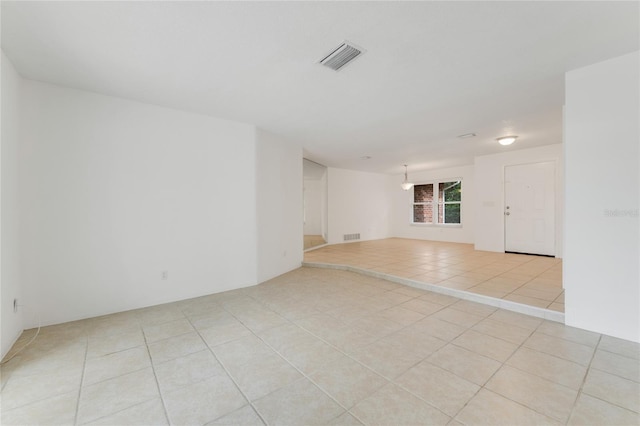 tiled empty room featuring basketball hoop