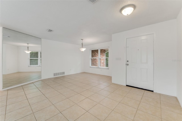 empty room featuring light tile patterned flooring