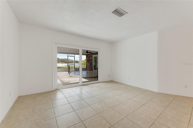 660 Saxon Blvd, Deltona, FL 32725 - spare room featuring tile patterned flooring, a textured ceiling, and ceiling fan