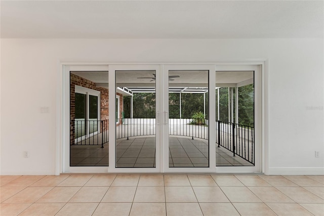 doorway featuring a wealth of natural light and light tile patterned flooring