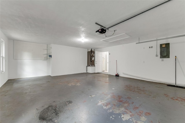 660 Saxon Blvd, Deltona, FL 32725 - garage with electric panel and a garage door opener