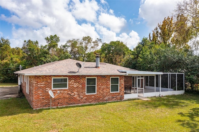660 Saxon Blvd, Deltona, FL 32725 - back of house featuring a sunroom, brick siding, a lawn, and roof with shingles