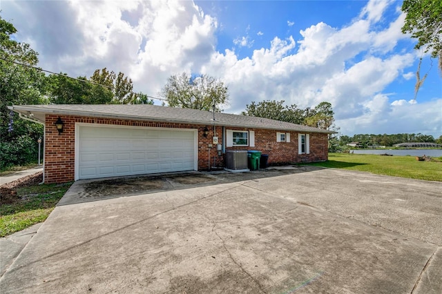 660 Saxon Blvd, Deltona, FL 32725 - single story home with brick siding, driveway, central AC, and a garage