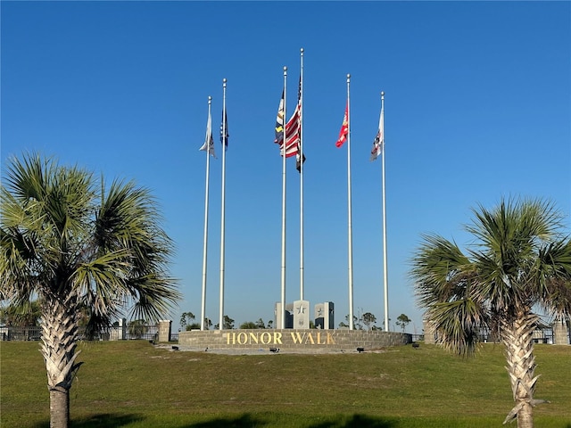 view of property's community with a lawn