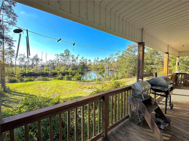 deck featuring a water view and grilling area