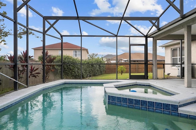 view of pool featuring an in ground hot tub and a lanai