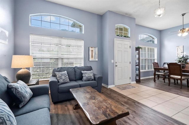 living room with wood-type flooring, plenty of natural light, and ceiling fan