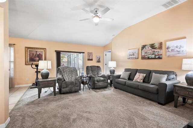 carpeted living room with ceiling fan and lofted ceiling