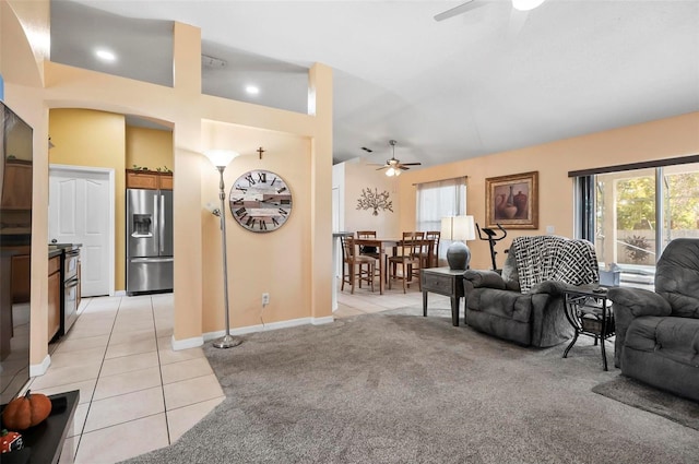 tiled living room featuring ceiling fan