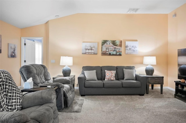 carpeted living room featuring vaulted ceiling