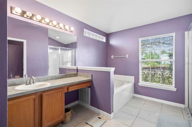 bathroom with vanity, vaulted ceiling, a wealth of natural light, and separate shower and tub