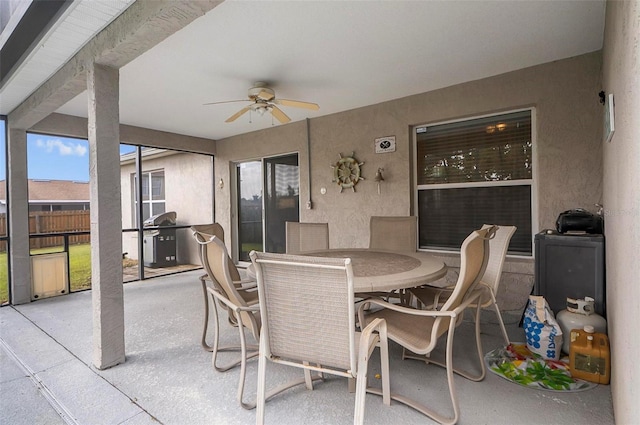 sunroom / solarium with ceiling fan