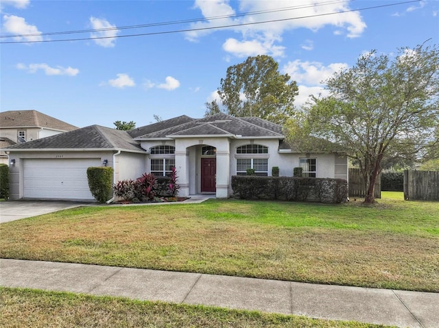 ranch-style house with a front yard and a garage