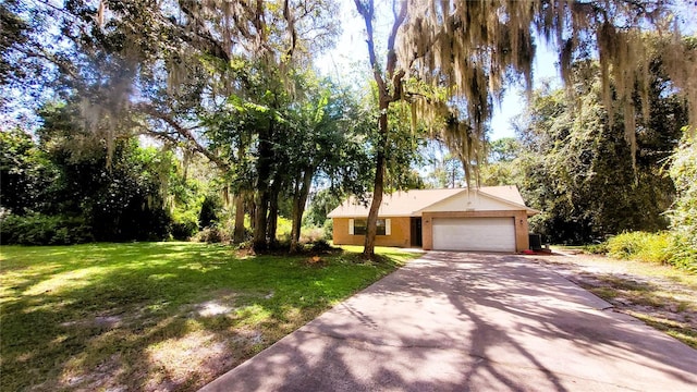 ranch-style home with a front yard and a garage