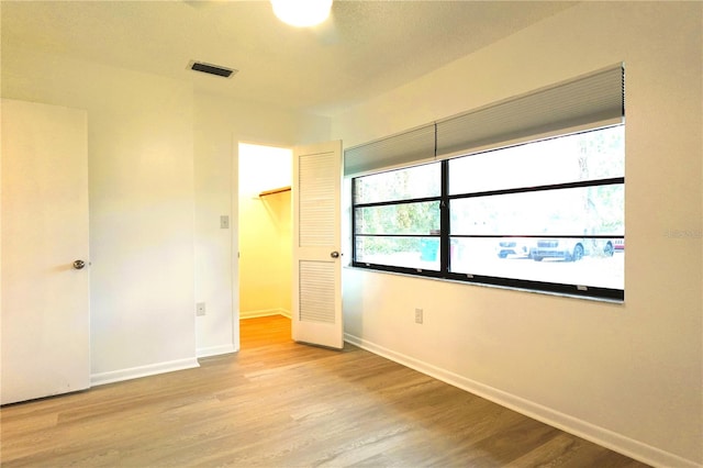 unfurnished bedroom with light hardwood / wood-style floors