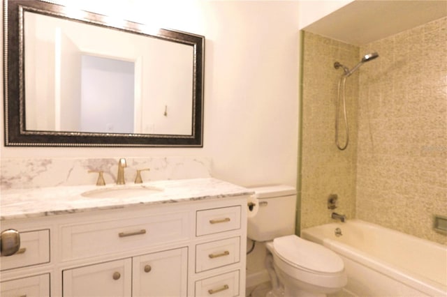 full bathroom featuring vanity, toilet, and tiled shower / bath combo