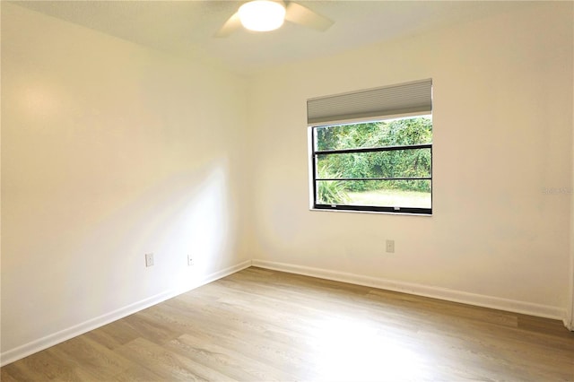 spare room with light hardwood / wood-style flooring and ceiling fan