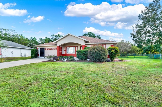 ranch-style house with a garage and a front lawn