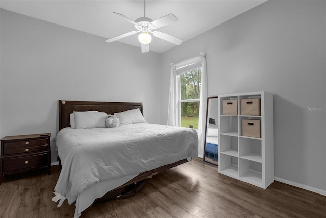 bedroom featuring dark wood-type flooring and ceiling fan