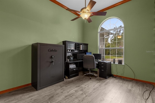 office with ceiling fan, light wood-type flooring, and ornamental molding