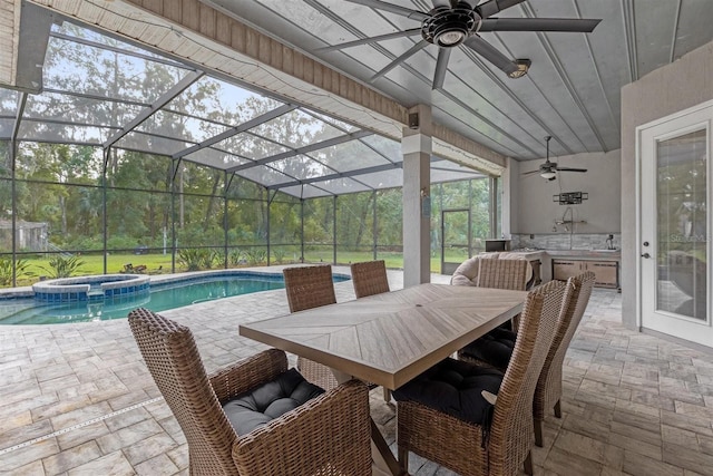 view of swimming pool featuring a lanai, ceiling fan, a patio, and an in ground hot tub