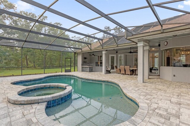 view of swimming pool featuring an in ground hot tub, a patio area, ceiling fan, a lanai, and area for grilling