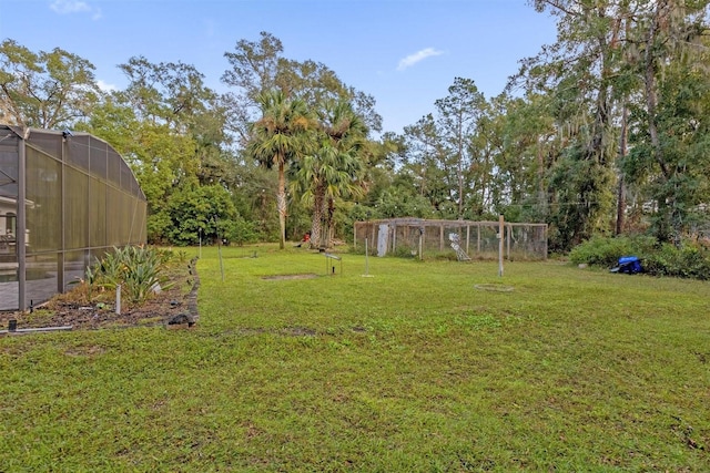 view of yard featuring a lanai