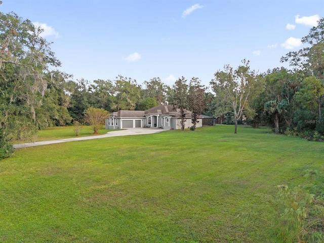 view of yard with a garage