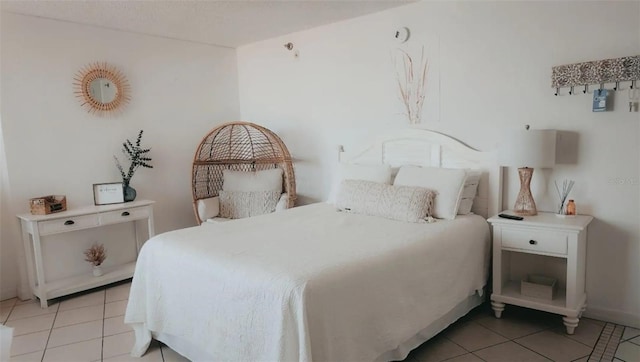 bedroom featuring light tile patterned floors