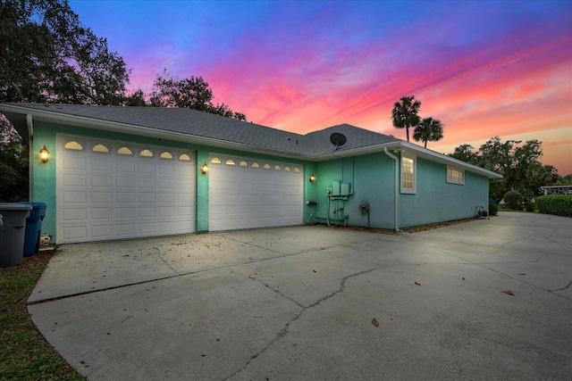 single story home featuring a garage