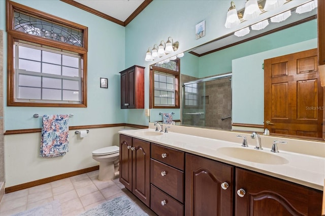 bathroom featuring ornamental molding, toilet, an enclosed shower, and plenty of natural light