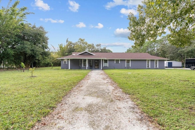 ranch-style house featuring a front yard