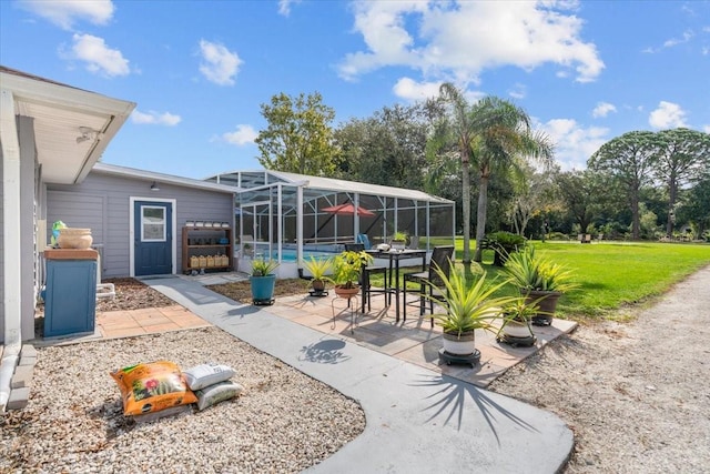 exterior space with a lanai and a pool