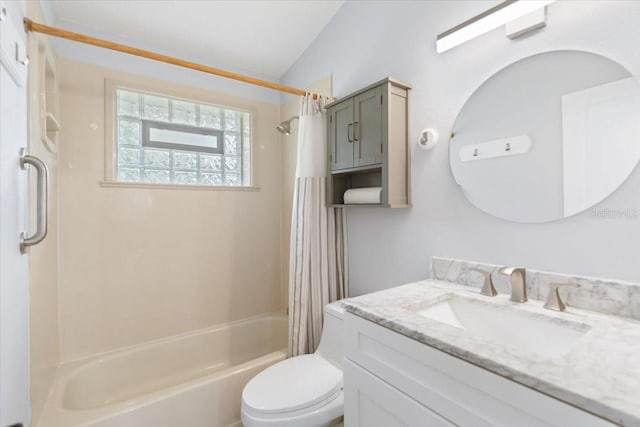 full bathroom featuring toilet, vanity, shower / bath combination with curtain, and lofted ceiling