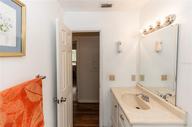 bathroom featuring wood-type flooring and vanity