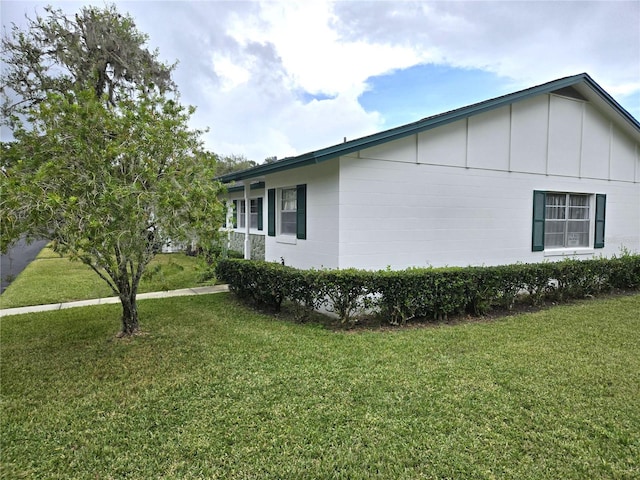 view of home's exterior with a yard