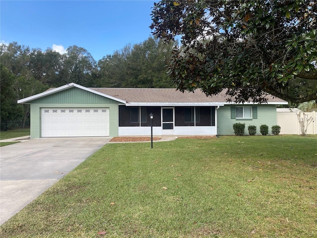 single story home featuring a garage, a front lawn, and a sunroom