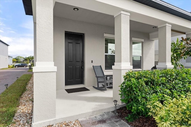 entrance to property with covered porch