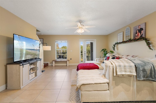 tiled bedroom featuring a textured ceiling, access to outside, and ceiling fan